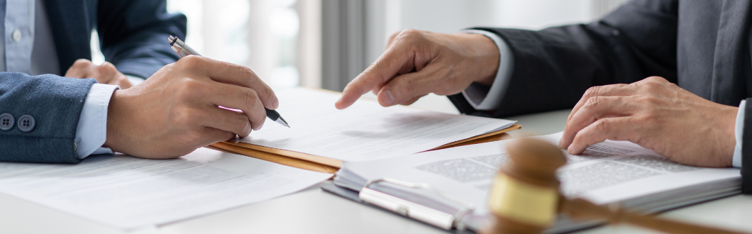 two people discussing paperwork